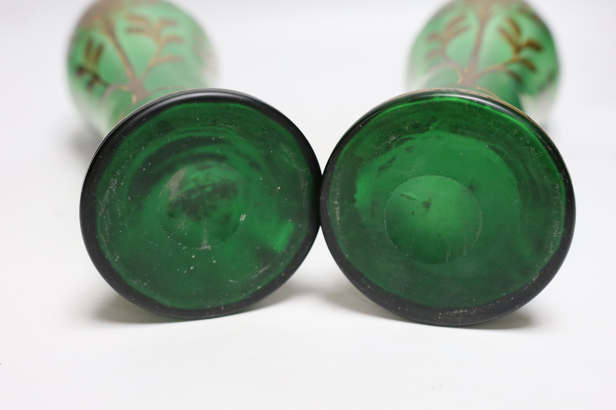 A pair of French green glass and gilt decorated Art Nouveau vases, 34cms high